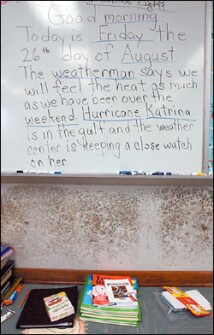 Mold grows beneath the whiteboard in a portable classroom at Paul J. Solis Elementary School in Gretna, La. Its message was written just before Hurricane Katrina.
