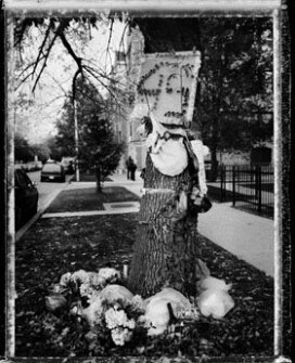 A memorial stands on display for Leonard Truss, a 17-year-old student who was shot and killed this summer in the community surrounding Dyett High School. Violence in the neighborhood is one reason why residents worry about students having to travel farther on their commute to another school.