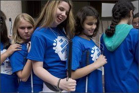Brianna Murray, 14, from Charleston, S.C., Morgayne Mulkern, 14, from Bridgewater, Mass., and Christina Moore, 14, from West Chazy, N.Y., line up as they prepare to enter the Braille Institute for the opening ceremony.