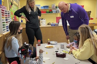 Gregg Wieczorek, president of the National Association of Secondary School Principals, with students at a daycare center at Clarkstown South High School in West Nyack, N.Y.