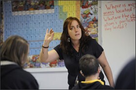 Teacher Imogen Herrick leads a science class at The Academy @Shawnee. She has noticed that her 10th graders have better attendance this school year. “They really recognize they are having success in school, so they are coming, and coming regularly,” she says.