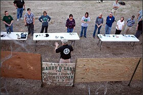 Range owner Johnny Price, center bottom, leads a concealed handgun training class offered to teachers and staff from the Clifton Independent School District in Clifton, Texas.
