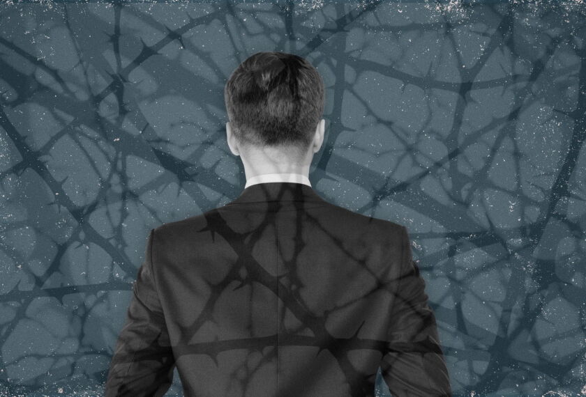 Man in suit, collaged with thorny branches in front and behind him.