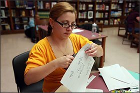 Sarah Gleason works during an online training class for teachers last month at Nolan Elementary-Middle in Detroit as part of the Education Achievement Authority.