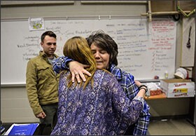 As she makes the rounds at Coatesville High School in Coatesville, Pa., Superintendent Cathy Taschner hugs choir student Katie Ernst, 17. Taschner is collaborating with an independent volunteer group that helps parents of students with disabilities to navigate the system.