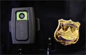 The rush by cities to outfit police officers with body cameras after last summer's police shooting of an unarmed teenager in Ferguson, Mo., is raising concerns about the use of the devices by law enforcement officers who work in schools.