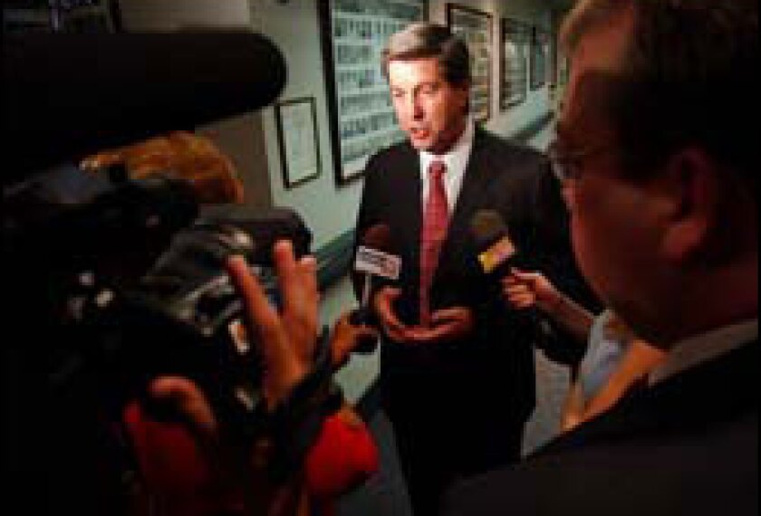 GOP Gov. Bob Riley talks to reporters. 