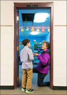 Terri Peters, a behavior interventionist at Elliott Elementary School in Holt, Mich., coaches a student on resolving a conflict.