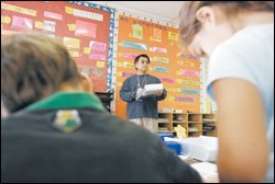 Inspecting overall classroom conditions.