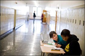 Math teacher and coach Alison Strom helps student Ania Warren with her algebra at Roosevelt High.
