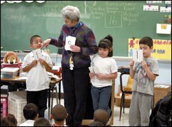 Barbara Healy, who is board certified, teaches spelling to her kindergartners at Stowe Academy in Chicago. A fraction of the city's teachers hold the credential.