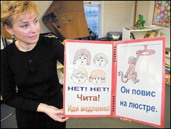 Elena Farkas displays an introductory book that Turnagain Elementary School uses to teach basic Russian to its pupils.