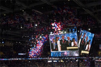 Surrounded by their families, Donald Trump and Mike Pence watch the traditional balloon drop at the close of the Republican National Convention in Cleveland.