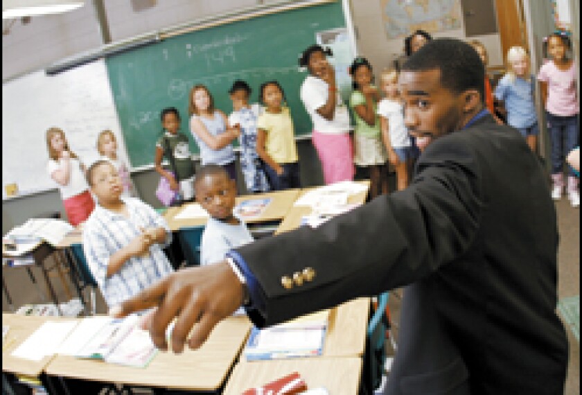 Hayward Jean, a second-year teacher and a graduate of the Call Me MISTER program, goes over a few rules with his students before they head out to lunch. Jean teaches 3rd grade at Greendale Elementary School in New Ellenton, S.C.
