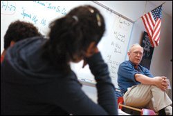 Annandale High School government teacher John H. Hawes discusses immigration issues with his 10th grade class on March 30. Earlier in the week, students at the Fairfax County, Va., school staged a walkout to protest federal proposals targeting illegal immigration.