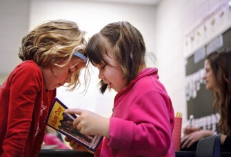 Kindergarten pupils Piper Stephan, left, and Delaney Lane read to each other at Triadelphia Ridge Elementary School in Glenelg, Md. Maryland is one of 46 states plus D.C. to adopt new common standards in math and English/language arts for K-12.