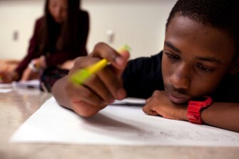 Ryan Welch, 12, right, and Sharon Choi, 14, spread out on the floor as they work on their projects in the Geometry Through Art class during Center for Talented Youth summer program at Lafayette College.