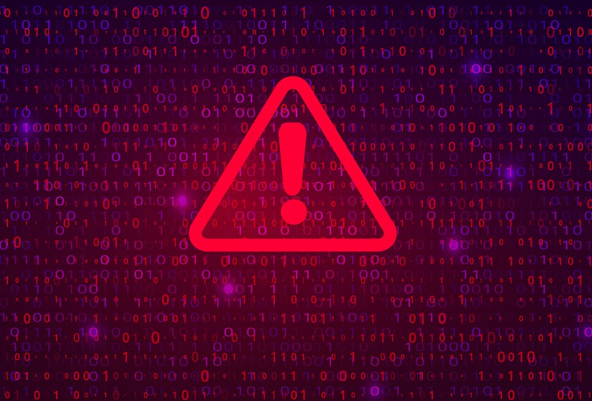 Image of a red glowing caution sign over a dark field of data.