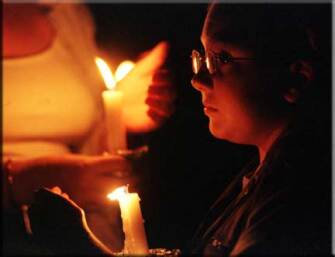 Fifth- grader Alex Penland holds a candel at a vigil at the U.S. Capitol building to remember those who died on Tuesday.