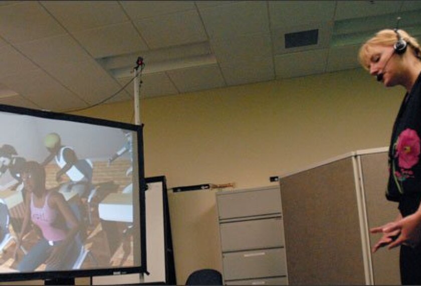 Krista Vince Garland teaches a science lesson to the virtual students in the TeachME Lab at the University of Central Florida.