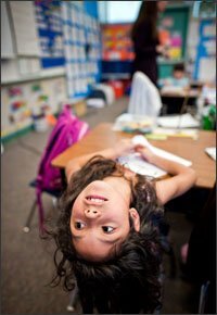 Veronica Flores, a 2nd grader at Lone Star, leans back to answer a question in teacher Allison Holt’s class. Lone Star is one of the schools in the district where academic performance improved following the introduction of response to intervention.