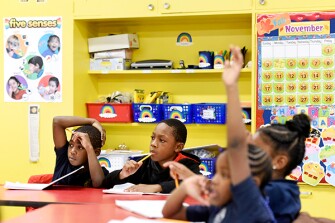 Moravia Park Elementary School 2nd graders Awaicha Tafah, left, and Courtland Young, second from left, take part in the early architecture class, which is taught during the school day at Moravia.