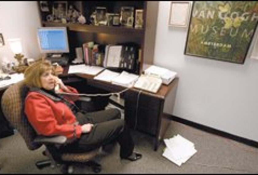 Margaret Garcia Dugan, Arizona's deputy superintendent for public instruction, prepares for a recent meeting at the state Capitol. She oversees state policy for English-learners.