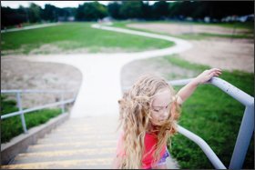 Six-year-old Selah Pultz walks up the stairs after doing a lap on the track during recess at Eastridge Elementary School in Lincoln, Neb.