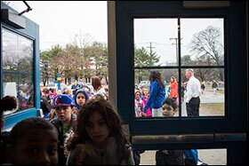 Students make their way to class at Vance Village Elementary School in New Britain, Conn.