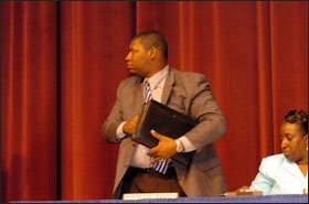 Member Norreese Haynes leaves after being dismissed over questions about his residency.