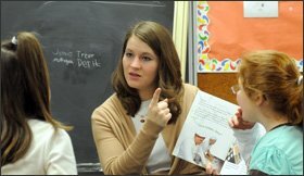 Third grade students work with teacher Sabrina Edsen during a guided reading group at the Lynville-Sully Elementary School in Sully, Iowa.