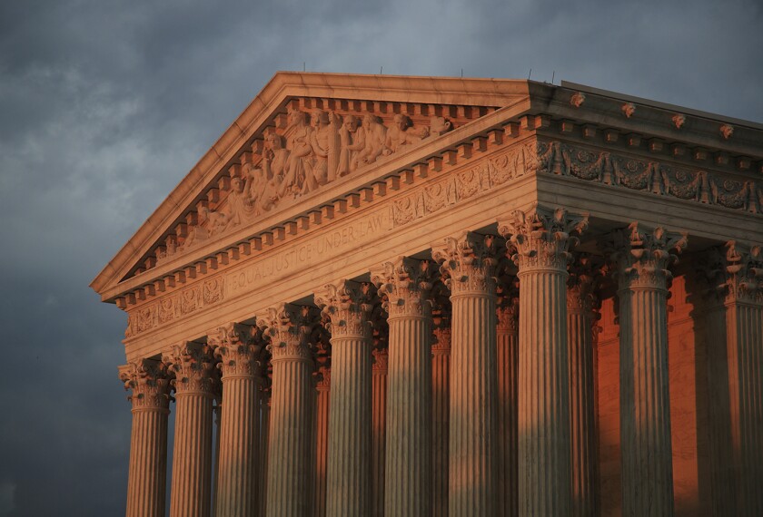 This Oct. 4, 2018, photo shows the U.S. Supreme Court at sunset in Washington. The Supreme Court has declined to take up an appeal from parents in Oregon who want to prevent transgender students from using locker rooms and bathrooms of the gender with which they identify, rather than their sex assigned at birth.