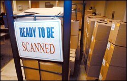 Boxes of tests arrive in the scanning room.