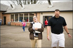 Katie Neuschwanger, a counselor and behavior specialist, walks with gym teacher Jeff Steindorf between classes at Yamhill Carlton Intermediate. The two co-teach a class on suicide prevention at the school, which was able to hire Neuschwanger as a full-time counselor.