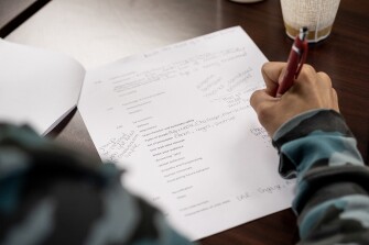An educator with the Benjamin Logan Local School District takes notes during the district's armed response team training in Bellefontaine, Ohio, on June 26, 2023.