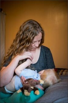 Dawn Von Tersch nurses her son, Jack, 1, in his room at her home in Fort Smith, Ark.
