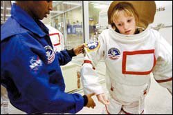 Rocket Kids: Chloe Ruffin, a 7th grader from Roseburg, Ore., gets into her gear for a 'space walk.'