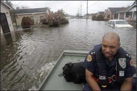Eddie Compass, shown in New Orleans' Katrina-flooded Ninth Ward in September 2005, resigned from the police force a month after the storm.