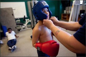 Second grader Jose Mercedes, 7, prepares to box during enrichment classes at the Emily G. Wetherbee School in Lawrence, Mass. Principal Colleen M. Lennon credits the variety of enrichment activities available to students as an essential part of her school’s, and the district’s, steady improvements.