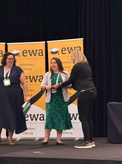 Alyson Klein receives her award during the Education Writers Association conference on June 3, 2026 in Baltimore.