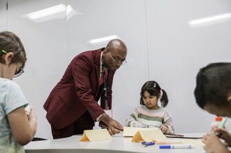 Anthony Vargas visits a 1st grade gifted and talented class at Baldwin Elementary School in Manassas, Va., on December 6, 2022.