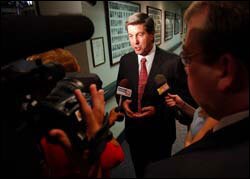 GOP Gov. Bob Riley talks to reporters. 