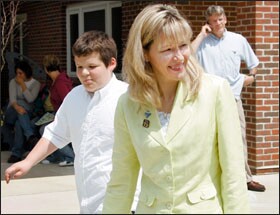 Sandee Winkelman, leaving Monarch School in University Heights, Ohio, on May 21 with her son Jacob, who has a form of autism, won a U.S. Supreme Court case last month allowing parents to represent themselves in lawsuits over special education.