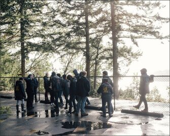 Students observe the nearby Puget Sound, looking for Orca whales during an Outdoor Education class at the Science and Math Institute in Tacoma, Wash.