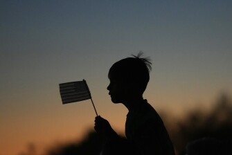 Damian Pecci, 8, of Scottsdale, Ariz., attends a Catholic rosary prayer vigil with his family and others for Charlie Kirk after he was shot and killed during a Utah college event onSept. 10, 2025, in Scottsdale, Ariz.