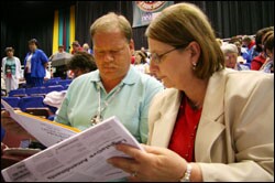 NEA delegates discuss issues on the floor of the Representative Assembly during the union's annual convention this week in Orlando, Fla.