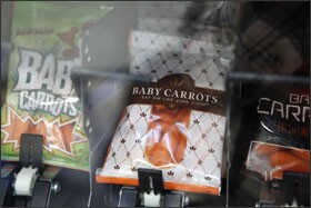 The baby carrots are intentionally packaged like junk food.
