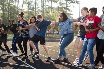 Students at Greene Central High School in Snow Hill, N.C., play a game during a field day event last month, when new freshmen met their junior and senior mentors who’ll help them navigate the complexities of their first year in high school.