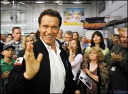 California Gov. Arnold Schwarzenegger seeks support for his ideas at a printing business in Burbank.
