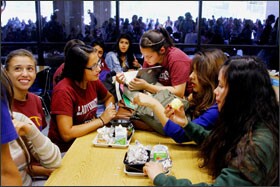 A group of friends share their meal as more than 1,000 students swarm the school cafeteria for lunch at Francisco Bravo Medical Magnet High School, in Los Angeles. In implementing its K-12 finance overhaul, California is requiring districts to change how they report data on individual students, particularly those eligible for the free and reduced-price lunch program.